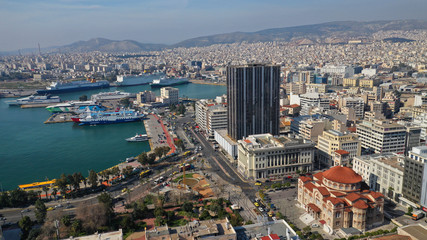 Aerial drone photo of abandoned old public landmark skyscraper in famous busy port of Piraeus,...