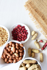 Dried peanuts (Arachis hypogaea) peanuts in shells, whole and chopped in containers