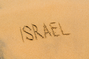 Fototapeta na wymiar Inscription israel on the sandy beach