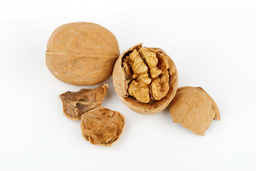 some cracked walnuts isolated on white background