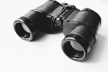 old black binoculars on white background