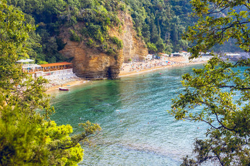 Sandy beach in the sea bay. Budva, Montenegro. Mogren Beach