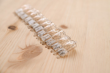 LED light bulbs on wooden background close up