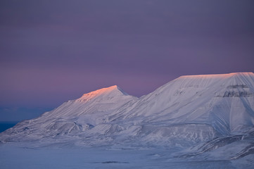 Naklejka premium norway landscape nature of the mountains of Spitsbergen Longyearbyen Svalbard arctic ocean winter polar day sunset sky