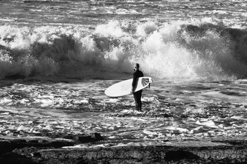 Surfer going to the sea