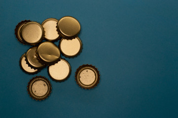 group of bottle caps on blue background