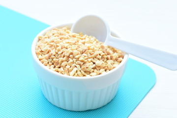 (Arachis hypogaea) chopped peanuts in containers