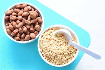 (Arachis hypogaea) chopped peanuts in containers