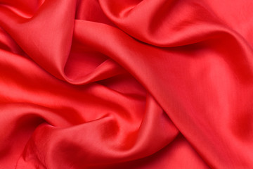 expensive fabric texture. abstract background with soft waves. Smooth elegant red silk or satin luxury cloth
