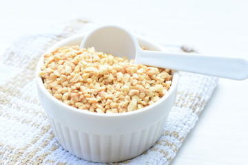 (Arachis hypogaea) chopped peanuts in containers