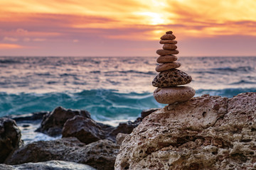 Fototapeta na wymiar Zen concept. The object of the stones on the beach at sunset. Harmony & Meditation. Zen stones. Relax.
