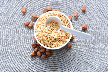 (Arachis hypogaea) dried whole peanuts without husk and chopped in containers