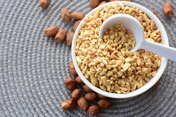 (Arachis hypogaea) dried whole peanuts without husk and chopped in containers