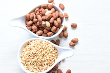 (Arachis hypogaea) dried whole peanuts without husk and chopped in containers