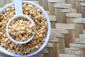 (Arachis hypogaea) chopped peanuts in containers