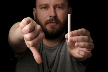 Hands bearded man with cigarette, close up. Give up smoking cigarettes. Man with bad harmful for...