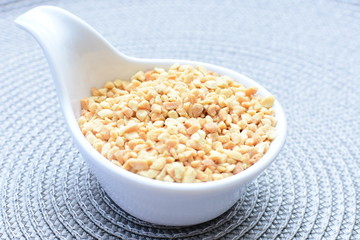 (Arachis hypogaea) chopped peanuts in containers