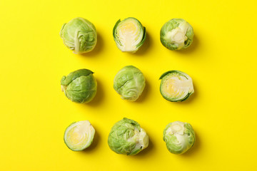 Flat lay with brussels sprout on yellow background, top view