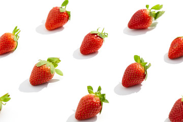 Fototapeta na wymiar Creative trendy pattern with fresh strawberry on white