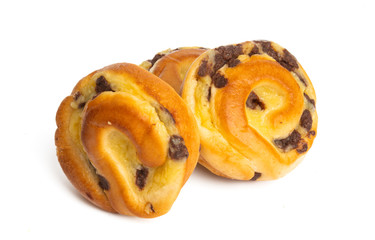 Bun with chocolate drops isolated