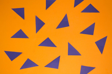 orange texture background with blue triangles