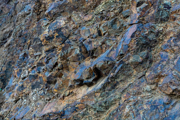 Geological formation with lava colums after magma eruption from stratovolcano