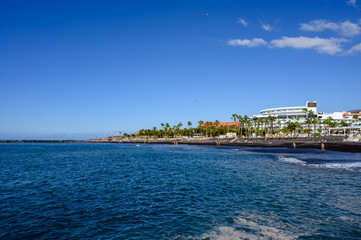 All year sun vacation destination, blue ocean water on  beach Playa del Duque in Costa Adeje, Tenerife island, Canary, Spain