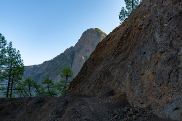 Scenic view on Caldera de Taburiente with green pine forest, ravines and rocky mountains near viewpoint Cumbrecita, La Palma, Canary islands, Spain