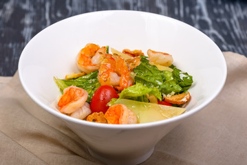 appetizer with shrimp, lettuce, cheese and tomatoes