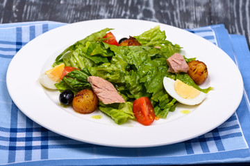 snack with tuna, potatoes, tomatoes, green salad and egg