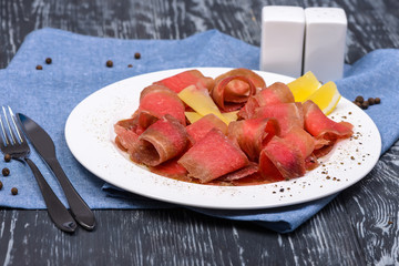 snack of slices of frozen beef venison