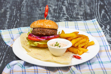 hamburger with French fries with sauce