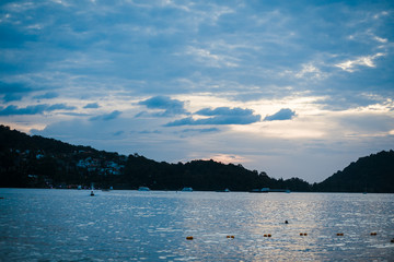 evening sea in thailand, waves and boats