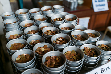 coins in the temple of the reclining buddha