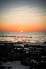 Fototapeta na wymiar Sunset on a beach in Masirah Island, Oman