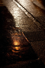 Yellow reflection on rainy pavement, Aix En Provence, France