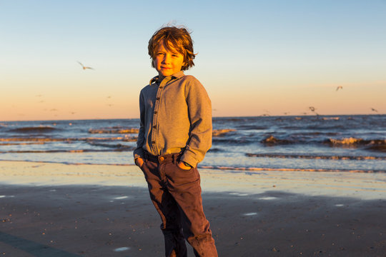 6 year old boy and seagulls, St. Simon's Island, Georgia,St Simon's Island