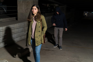 Robber Following Unaware Woman In Parking Lot