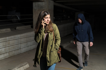 Thief Following Female Victim In Dark Alley