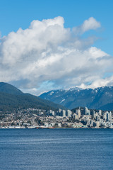 Vancouver, British Columbia, Canada - December, 2019 - Mountain View with clouds in a Beautiful blue sky day.
