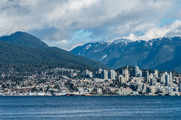 Fototapeta na wymiar Vancouver, British Columbia, Canada - December, 2019 - Mountain View with clouds in a Beautiful blue sky day.