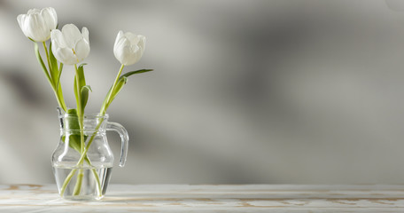 Desk of free space and spring flowers 