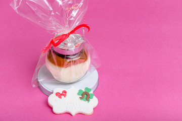 package of jar with creams on pink background, nice gift in March