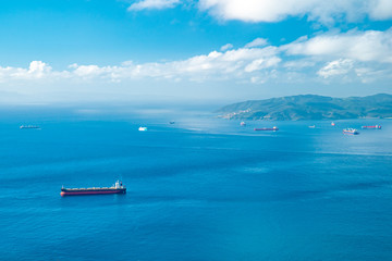 Cargo ship on the open sea, panorama. Copy space
