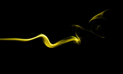 Yellow smoke on black background