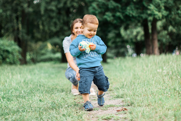 Fototapeta premium Mother play with son in the park.