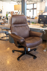 Brown leather office chair in store