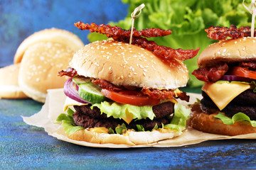Tasty fresh meat burgers with salad and cheese. Homemade angus burger.