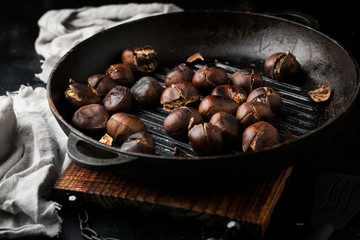 Grilled chestnuts in a frying pan