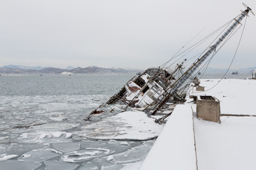 An old fishing vessel sank at pier